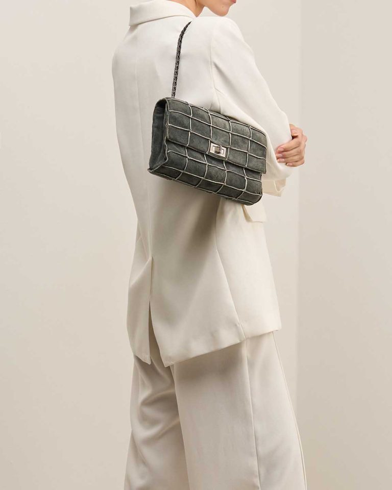 Chanel 2.55 Reissue 225 Suede Black on Model | Sell your designer bag