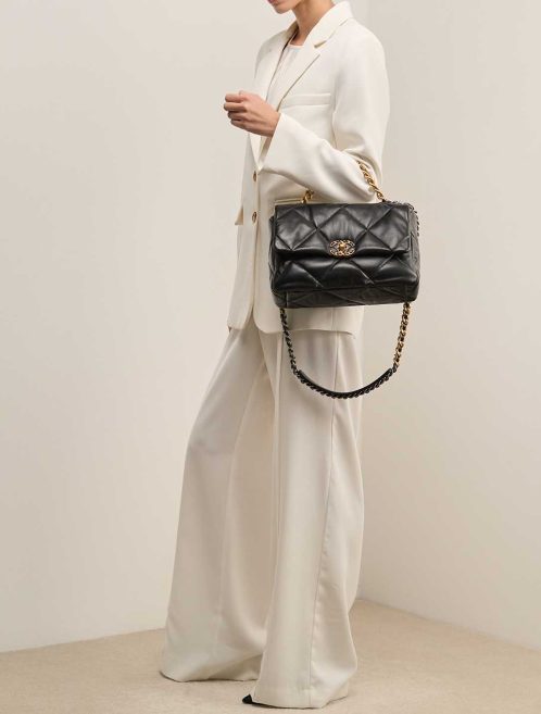 Chanel 19 Large Flap Bag Lamb Black on Model | Sell your designer bag