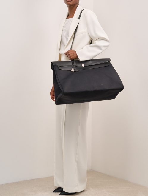 Hermès Herbag 50 Toile / Vache Hunter Black on Model | Sell your designer bag