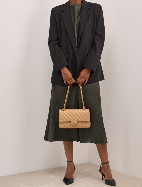 Chanel Timeless Medium Caviar Gold on Model | Sell your designer bag