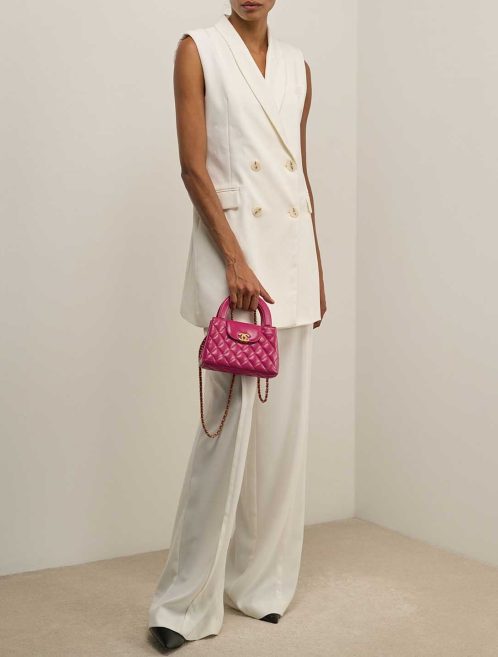 Chanel Kelly Medium Crinkled Calf Pink on Model | Sell your designer bag
