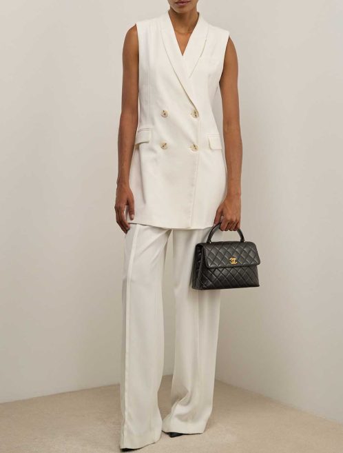 Chanel Timeless Handle Medium Lamb Black on Model | Sell your designer bag