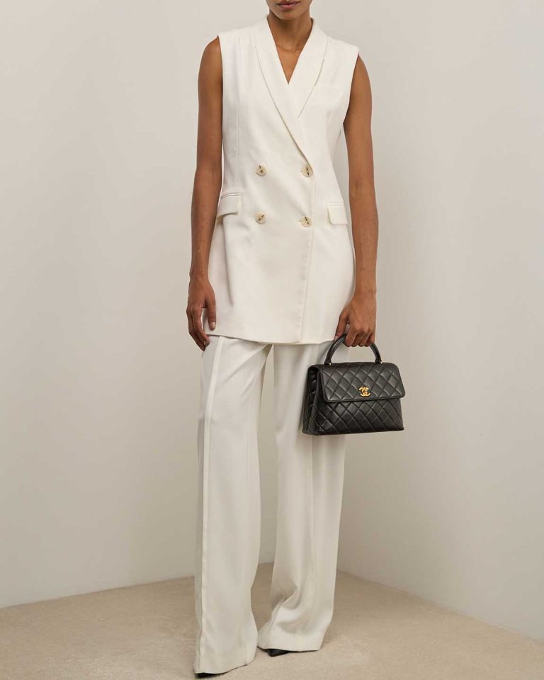 Chanel Timeless Handle Medium Lamb Black on Model | Sell your designer bag
