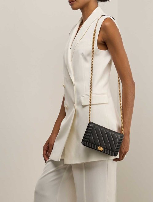 Chanel Boy Wallet On Chain Caviar Black on Model | Sell your designer bag