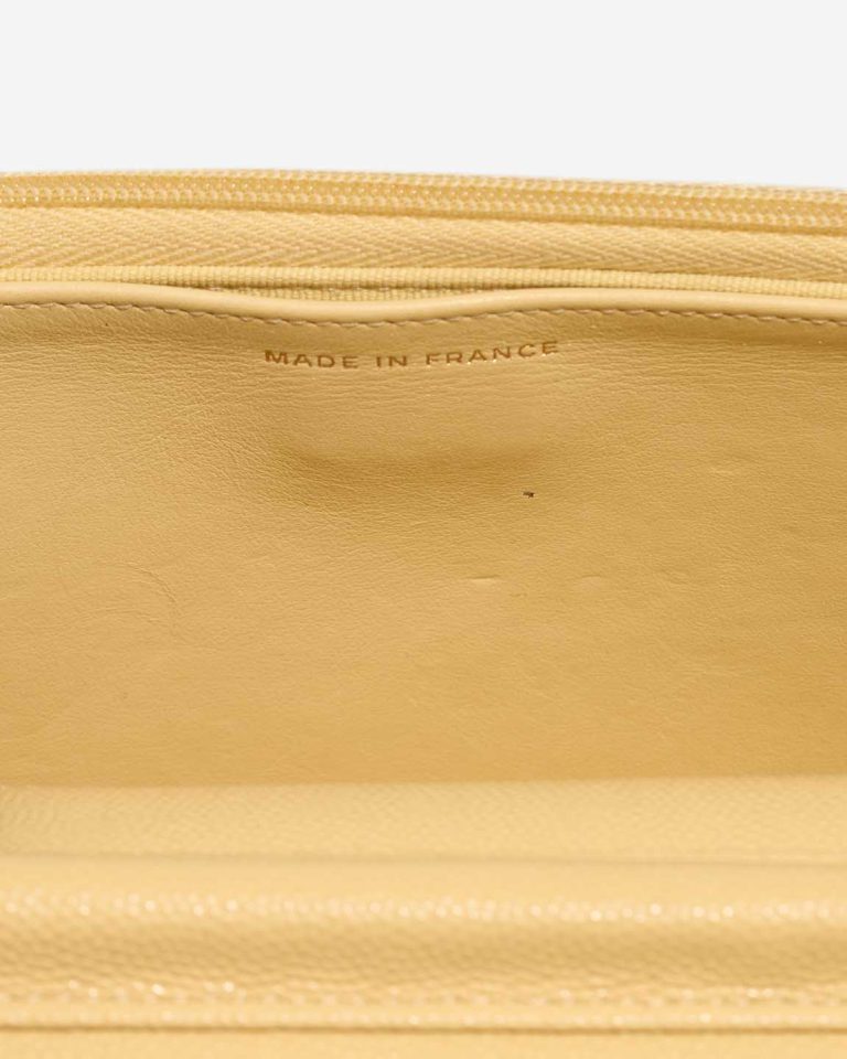 Chanel Wallet On Chain Caviar Yellow Signs of wear | Sell your designer bag