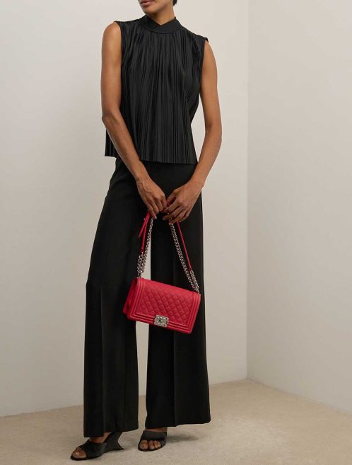 Chanel Boy Old Medium Caviar Red on Model | Sell your designer bag