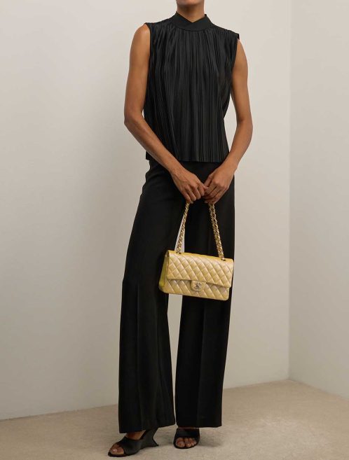 Chanel Timeless Medium Caviar Yellow on Model | Sell your designer bag