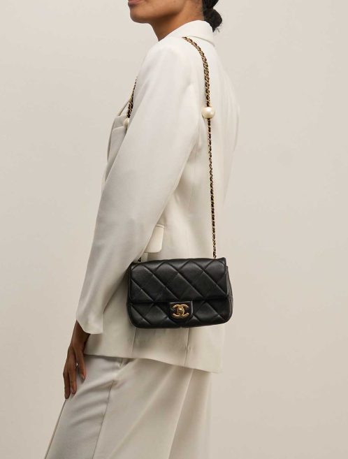 Chanel Timeless Mini Rectangular Lamb Black on Model | Sell your designer bag