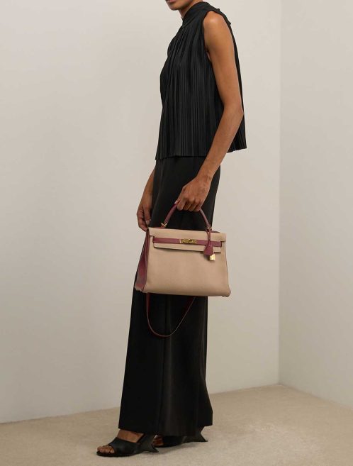 Hermès Kelly 32 Togo Trench / Rouge H on Model | Sell your designer bag