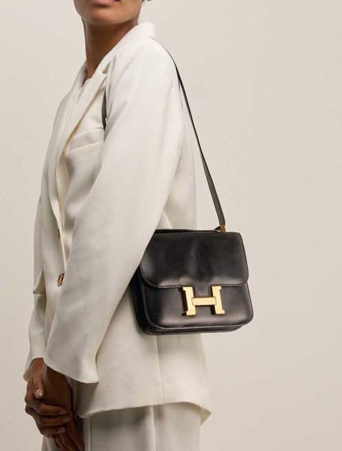 Hermès Constance 23 Box Black on Model | Sell your designer bag