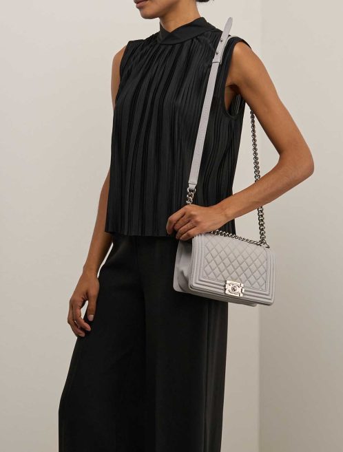 Chanel Boy Old Medium Caviar Light Grey on Model | Sell your designer bag