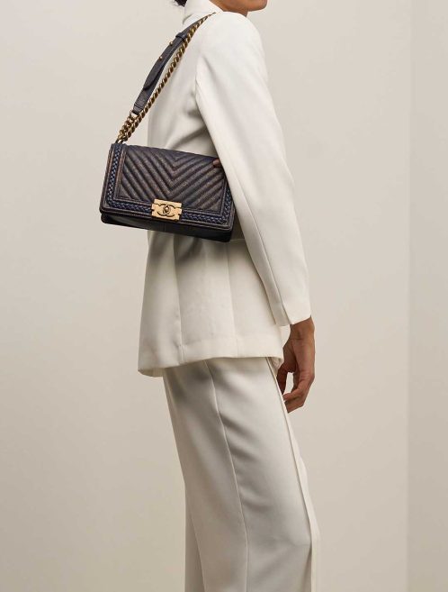 Chanel Boy Old Medium Caviar Blue / Metallic Gold on Model | Sell your designer bag