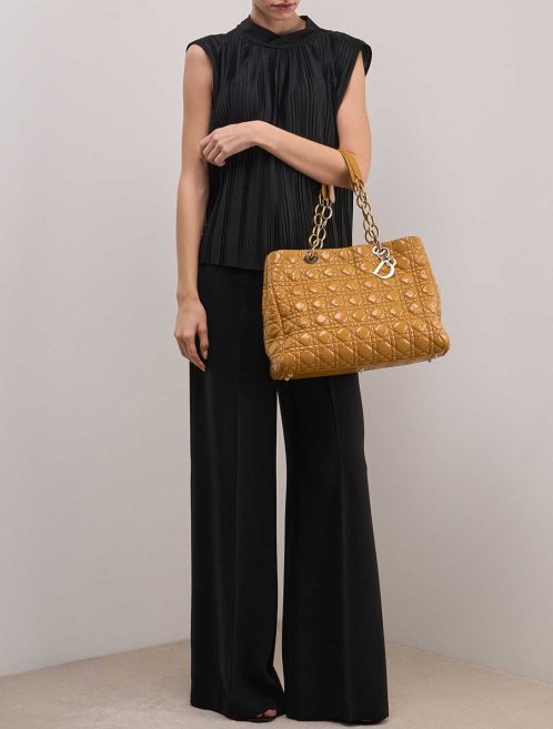Dior Shopper Medium Patent Mustard on Model | Sell your designer bag
