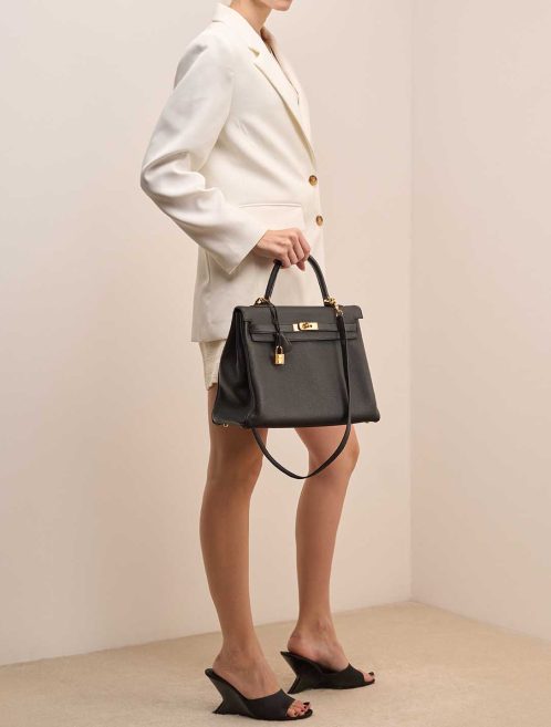 Hermès Kelly 35 Togo Black on Model | Sell your designer bag