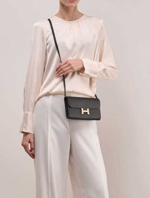 Hermès Constance To Go Black on Model | Sell your designer bag