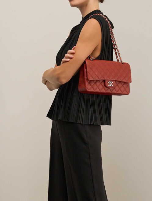 Chanel Timeless Medium Caviar Brique Red on Model | Sell your designer bag