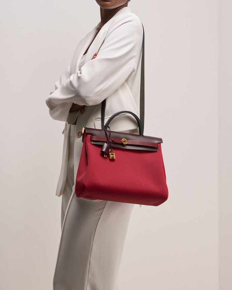 Hermès Herbag 31 Vache Hunter / Toile Rouge Sellier / Rouge Grenat / Rouge H on Model | Sell your designer bag