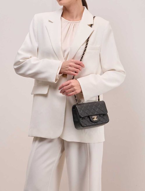 Chanel Timeless Mini Square Caviar Black on Model | Sell your designer bag