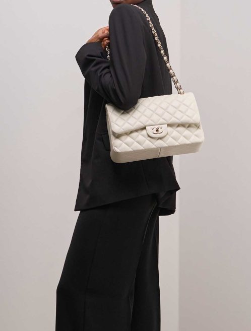 Chanel Timeless Jumbo Caviar Off White on Model | Sell your designer bag