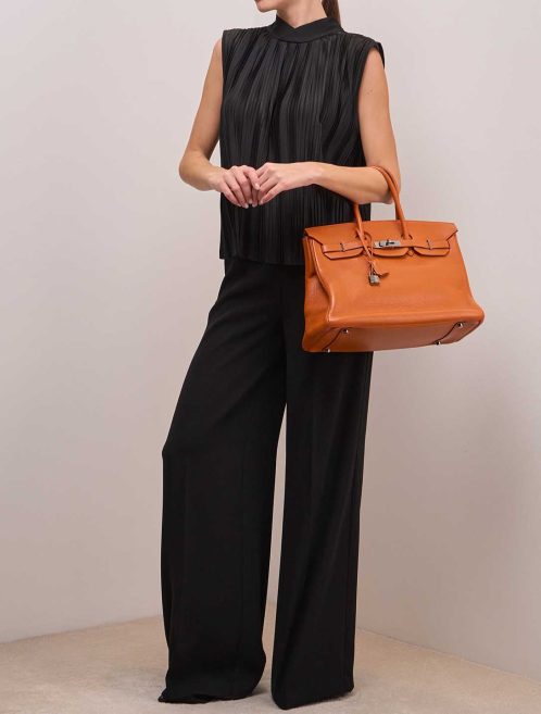 Hermès Birkin 35 Clémence Orange on Model | Sell your designer bag