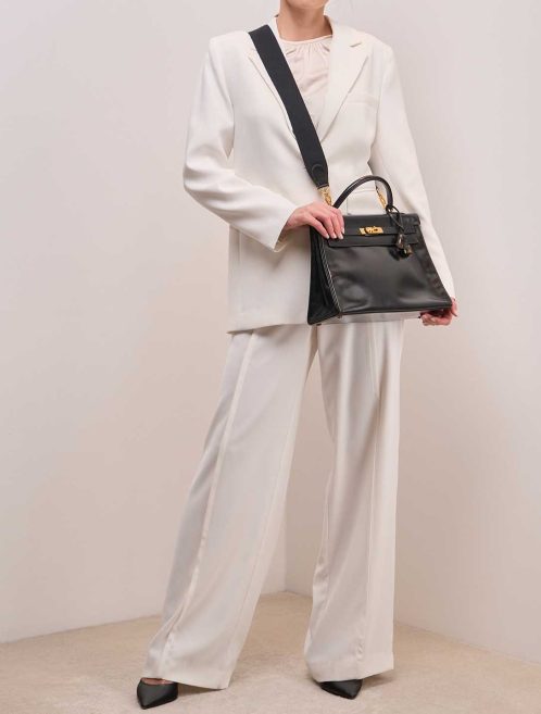 Hermès Kelly 32 Box Black on Model | Sell your designer bag