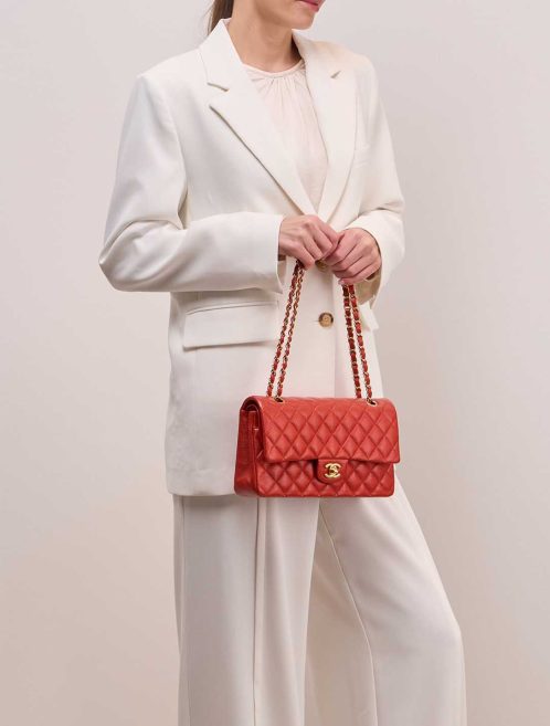 Chanel Timeless Medium Caviar Orange on Model | Sell your designer bag