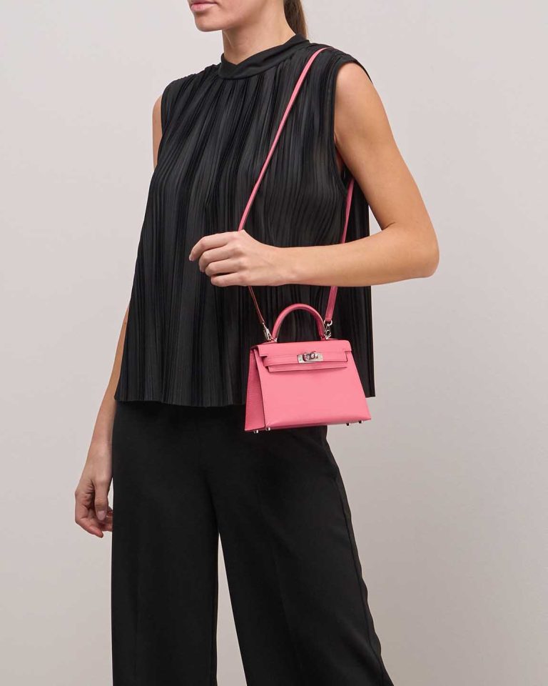 Hermès Kelly Mini Chèvre Mysore Rouge Venitien / Rose d'Été on Model | Sell your designer bag
