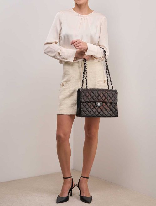 Chanel Timeless Jumbo Lamb Black on Model | Sell your designer bag