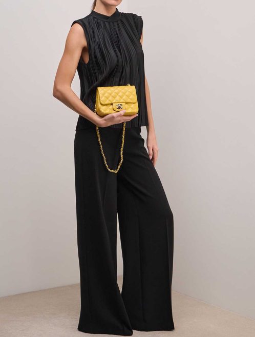 Chanel Timeless Mini Square Lamb Yellow on Model | Sell your designer bag