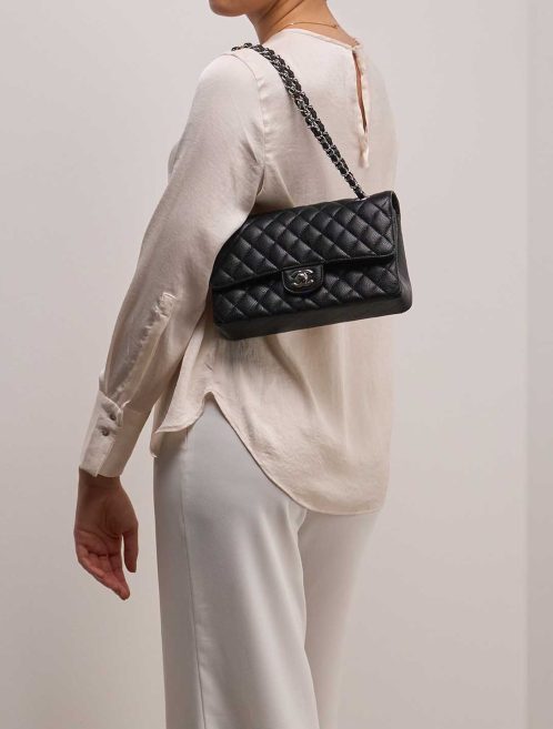 Chanel Timeless Medium Caviar Black on Model | Sell your designer bag