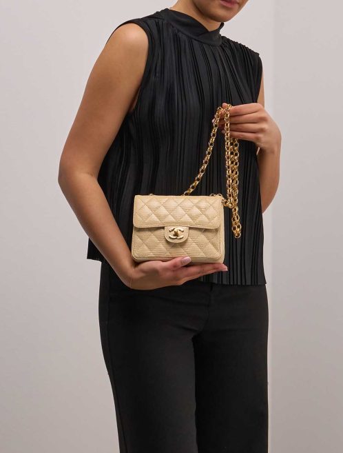 Chanel Timeless Mini Square Lizard Beige on Model | Sell your designer bag