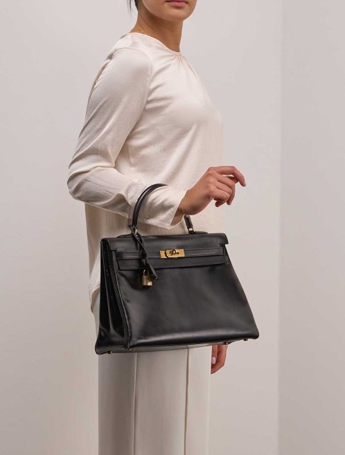 Hermès Kelly 35 Box Black on Model | Sell your designer bag