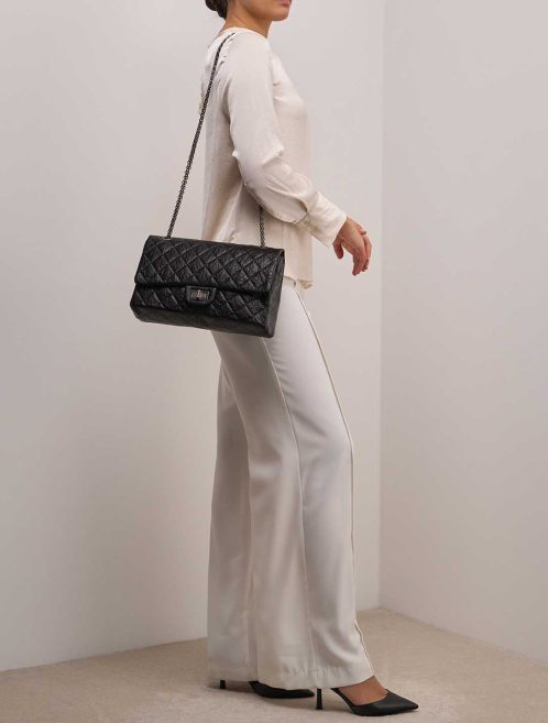 Chanel 2.55 Reissue 227 Crinkled Calf Black on Model | Sell your designer bag