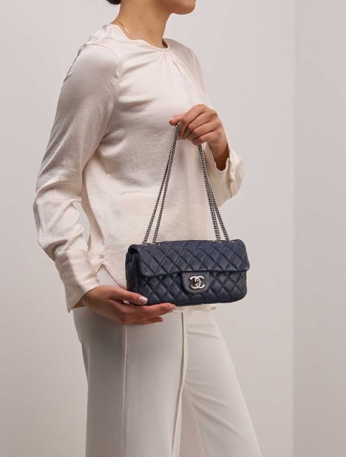Chanel Timeless Baguette Small Lamb Dark Blue on Model | Sell your designer bag