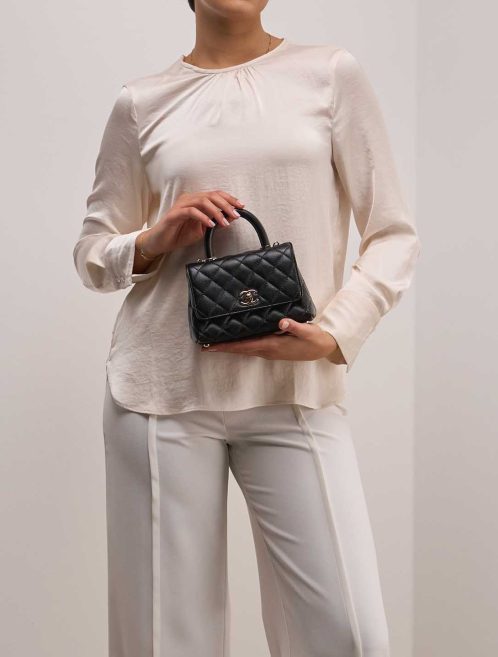 Chanel Timeless Handle Small Caviar Black on Model | Sell your designer bag