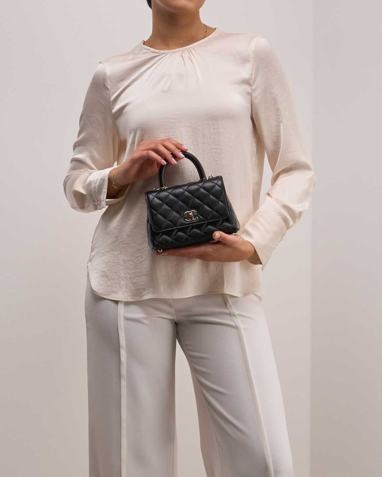 Chanel Timeless Handle Small Caviar Black on Model | Sell your designer bag