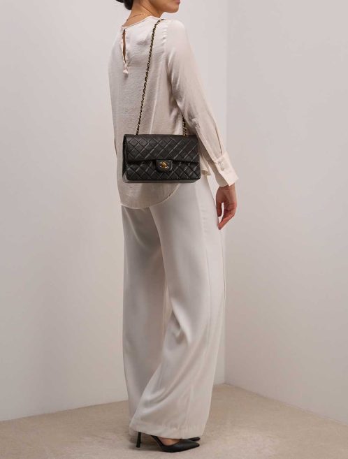 Chanel Timeless Medium Lamb Black on Model | Sell your designer bag
