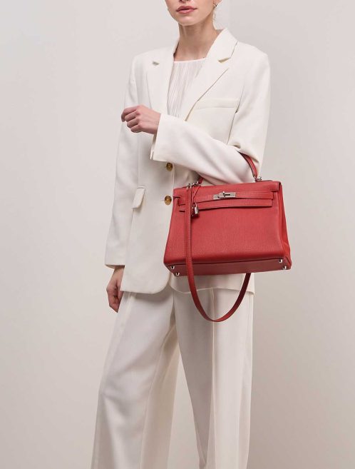 Hermès Kelly 32 Togo Rouge Vermillon on Model | Sell your designer bag
