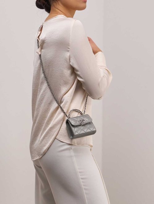 Chanel Timeless Handle Micro Lamb Silver on Model | Sell your designer bag