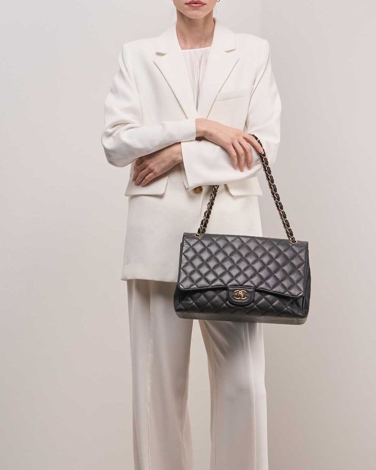Chanel Timeless Maxi Caviar Black on Model | Sell your designer bag