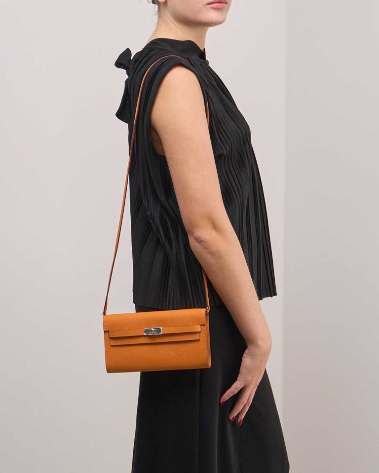 Hermès Kelly To Go Epsom Apricot on Model | Sell your designer bag