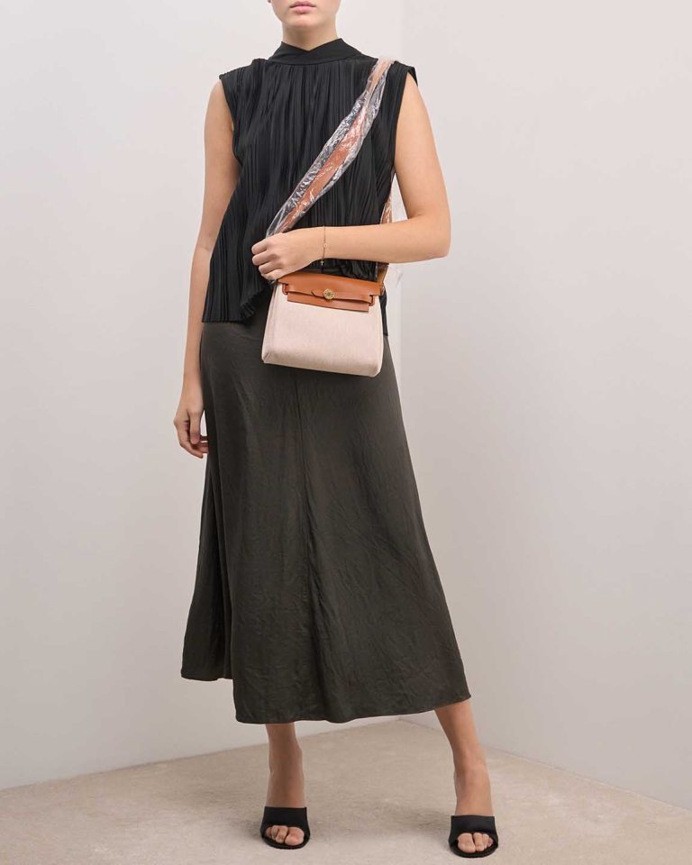 Hermès Herbag Mini Toile H / Vache Hunter Écru / Beige / Fauve on Model | Sell your designer bag