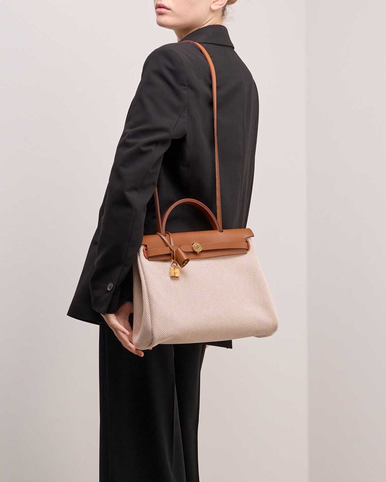 Hermès Herbag 31 Vache Hunter / Toile Écru / Beige / Fauve on Model | Sell your designer bag