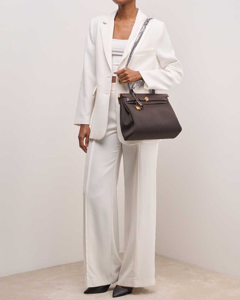 Hermès Herbag 31 Toile / Vache Hunter Ébène on Model | Sell your designer bag