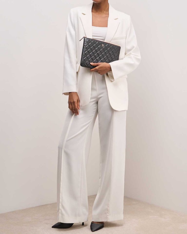 Chanel Timeless Clutch Caviar Black on Model | Sell your designer bag