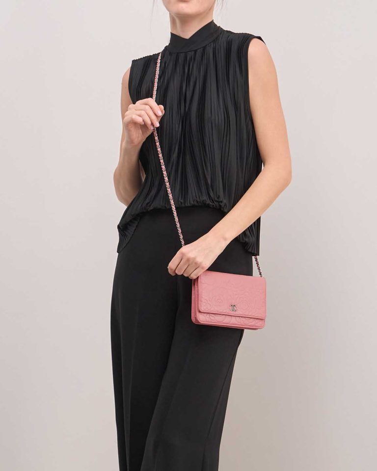 Chanel Wallet On Chain Camellia Lamb Pink on Model | Sell your designer bag